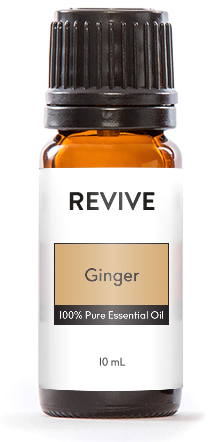 Revive Ginger Essential Oil bottle with fresh ginger root
