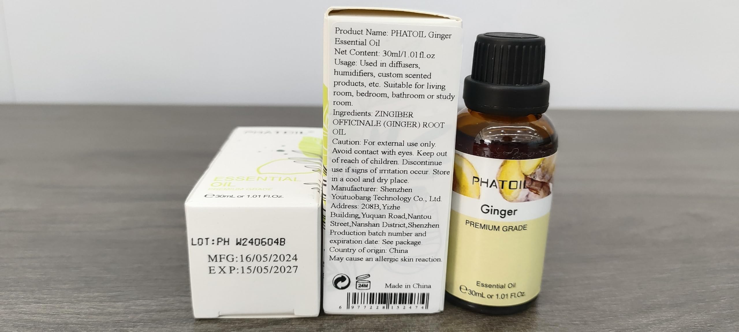 Close-up of ginger essential oil bottle label and dropper