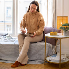 Close-up of glass diffuser and natural wood base detailing
