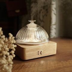 Glass dome essential oil diffuser with glass reservoir and wood base