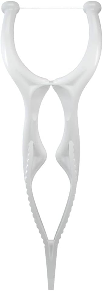 Floss pick tip reaching between teeth for hard-to-reach spots