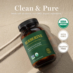 Global Healing Center berberine bottle beside a glass of water for daily wellness routine.