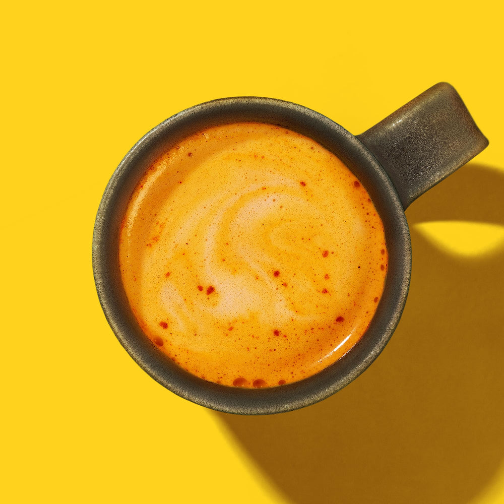 Coconut, turmeric, ginger, and ashwagandha ingredients arranged for Golden Hour latte