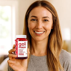 Goli open bottle spilling gummies demonstrating three-pack supply benefit