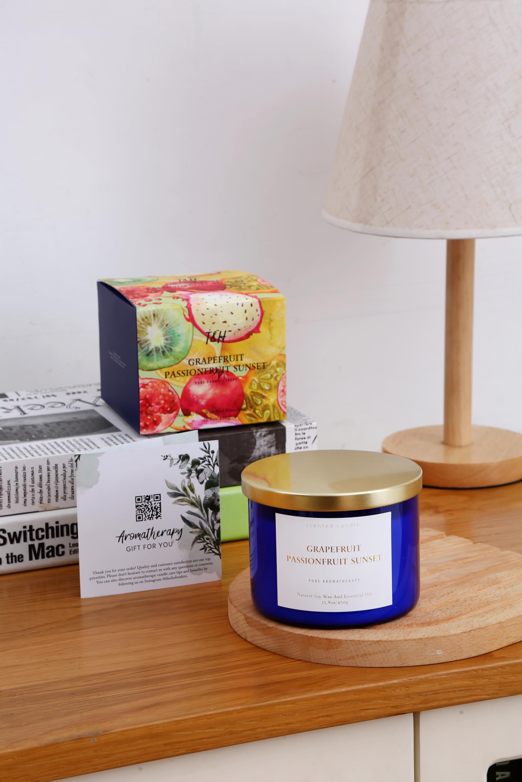 Blue glass candle jar shown in modern home decor setting