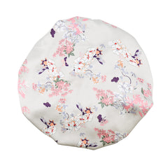 GreatRemy satin braid bonnet with silver flowers seen from the front, for hair protection while sleeping