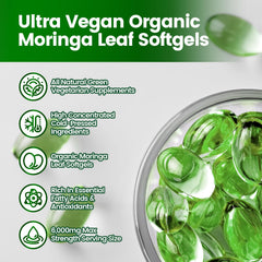 Green moringa capsules on white background