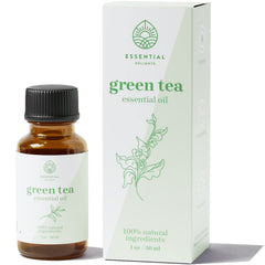 Green Tea Essential Oil bottle with leaves