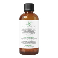 Aromatherapy setup with Green Tea Essential Oil, candle, and lotion