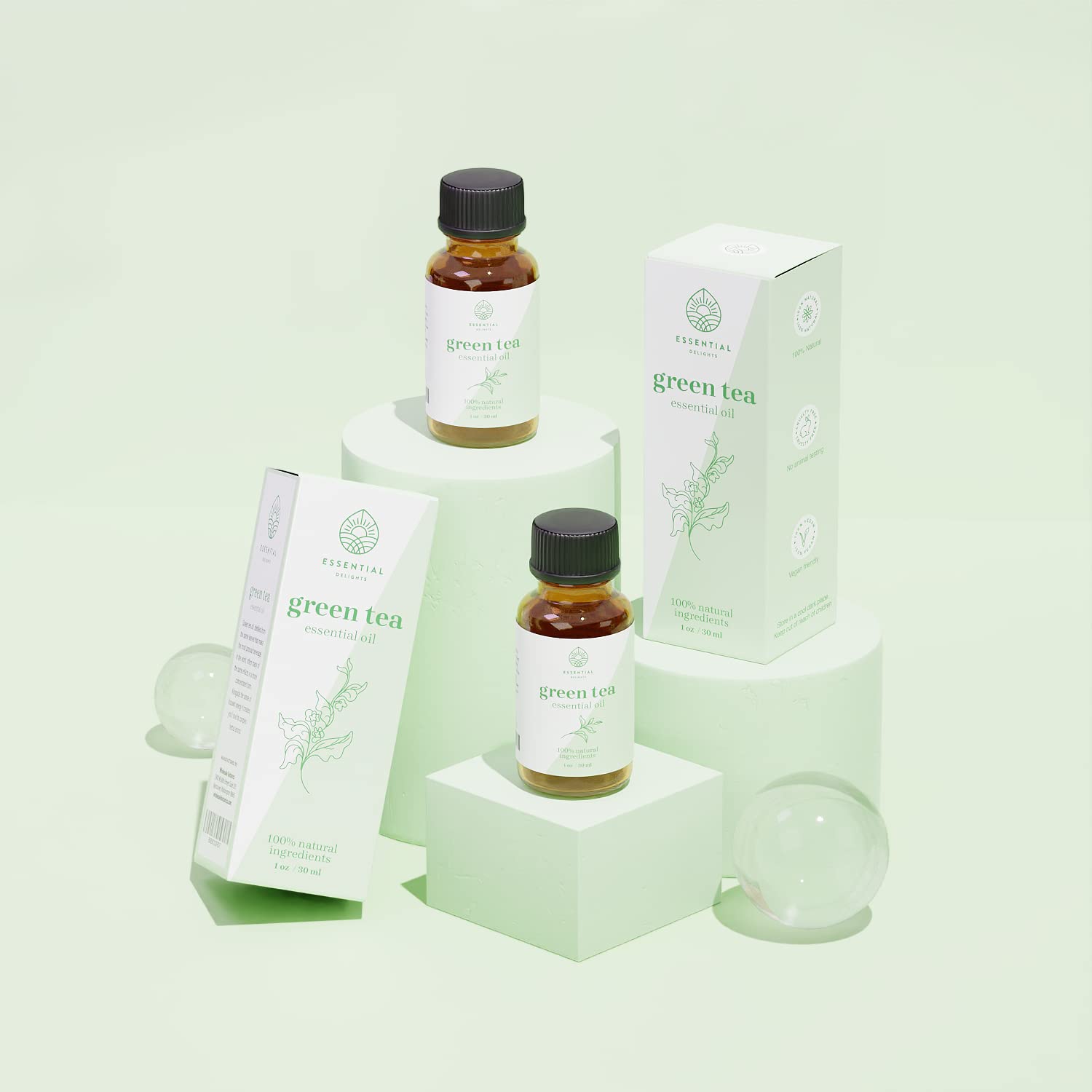 Vial of Green Tea Essential Oil on neutral background