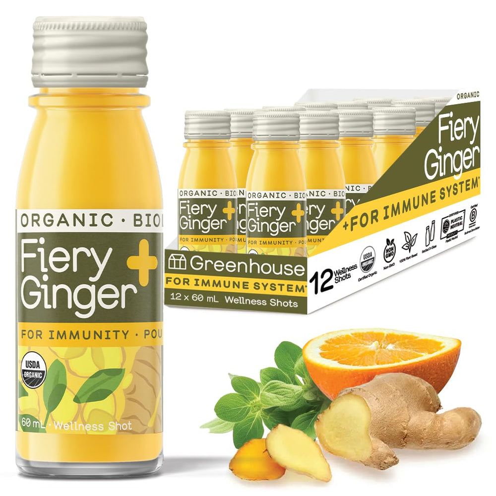 Front view of Greenhouse Juice Fiery Ginger Wellness Shot in a 60ml glass bottle