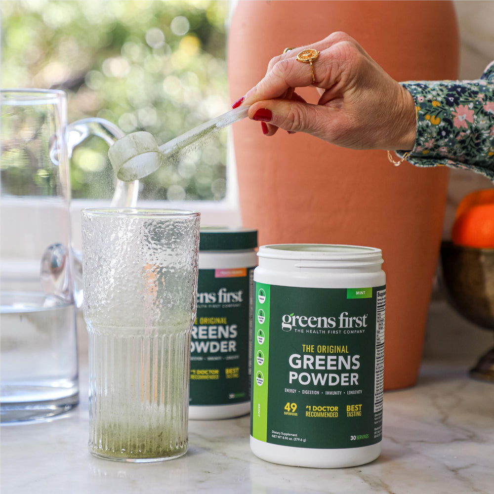Greens First berry flavor scoop ready for smoothies and shakes.