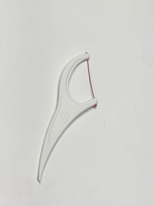 Close-up of Grin Smooth Floss Tape easy-grip handle