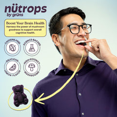 Grüns Nutrops lemon-flavored gummies close-up highlighting mushroom blend.