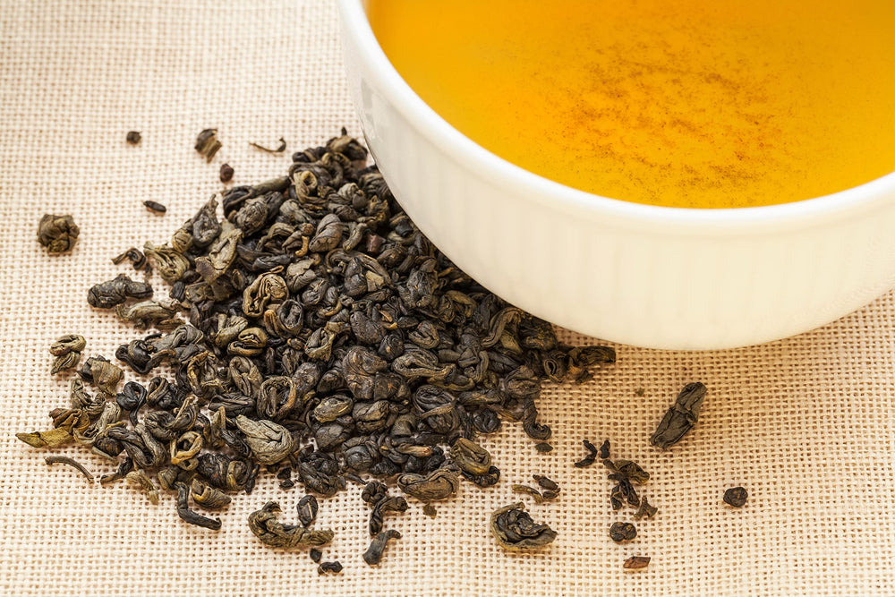 Deep golden liquor of steeped gunpowder green tea