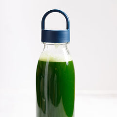 Graphic of greens and probiotics on Gut-Duction packaging