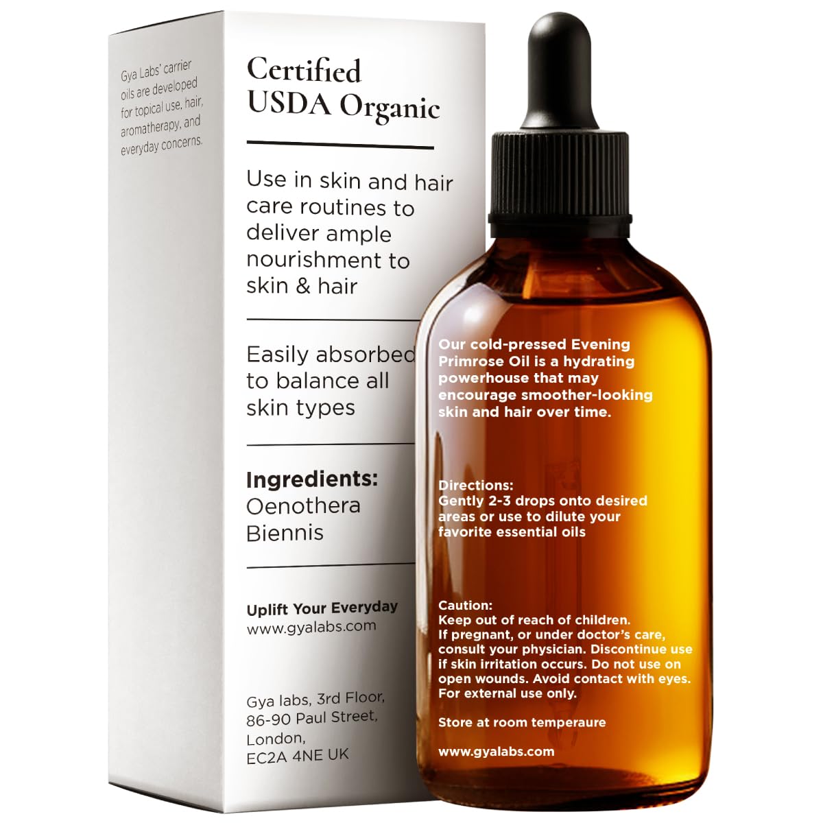 Hands massaging scalp with evening primrose carrier oil