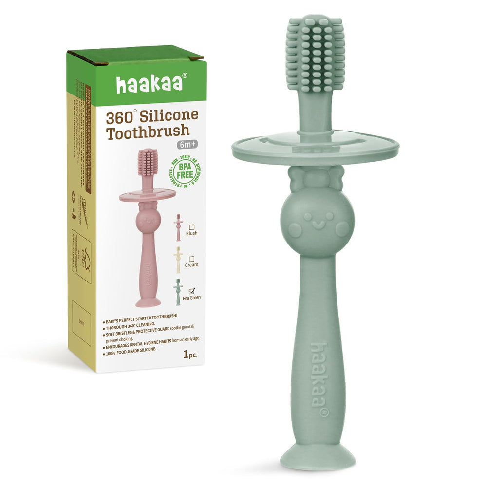 Product image showing Haakaa 360° Baby Toothbrush with suction base in pea green