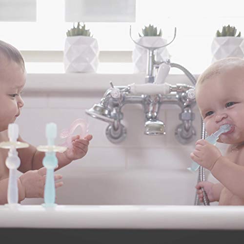Side view of Haakaa 360° silicone baby toothbrush pink