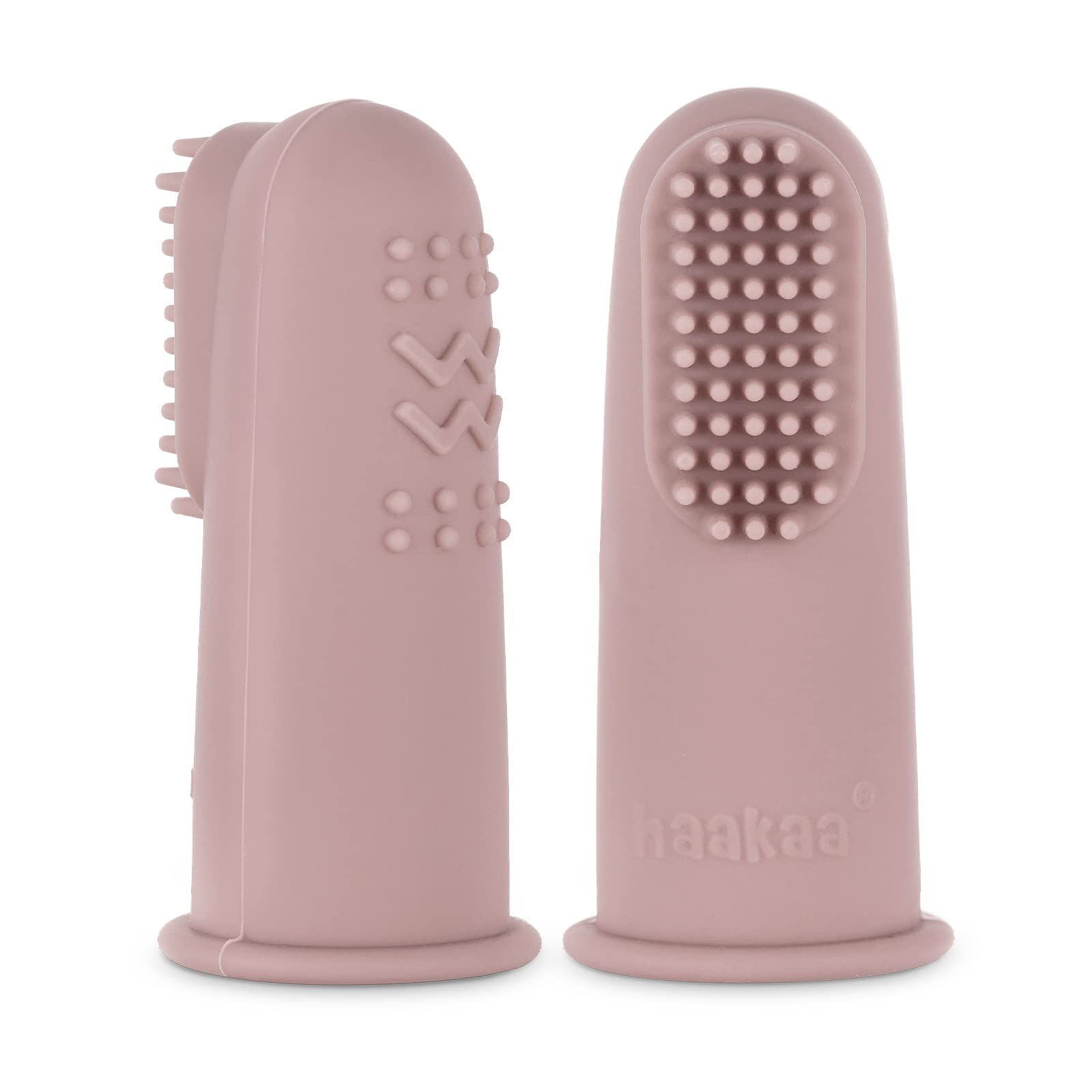 Blush Haakaa finger toothbrush held beside a hand