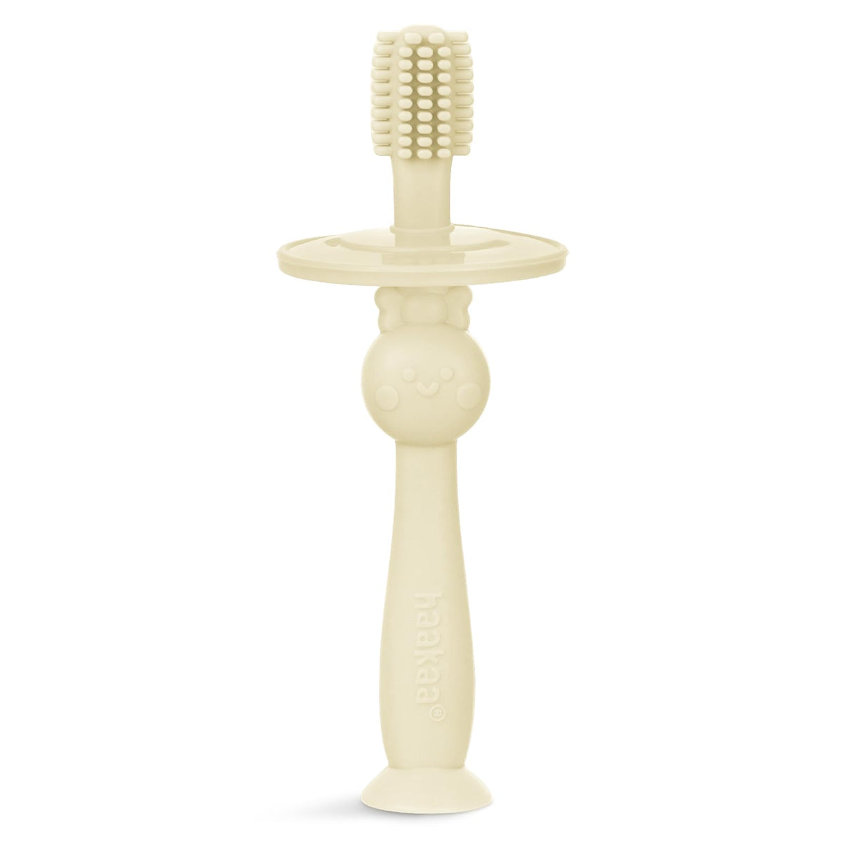 Cream Haakaa infant toothbrush with 360° bristle coverage