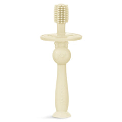 Cream Haakaa infant toothbrush with 360° bristle coverage