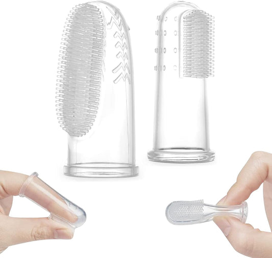 Finger toothbrush on baby's finger