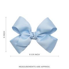 HAIRBOWS Knot-wrap center bow worn daily; complements many outfits.