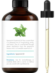Close-up of spearmint essential oil in amber bottle
