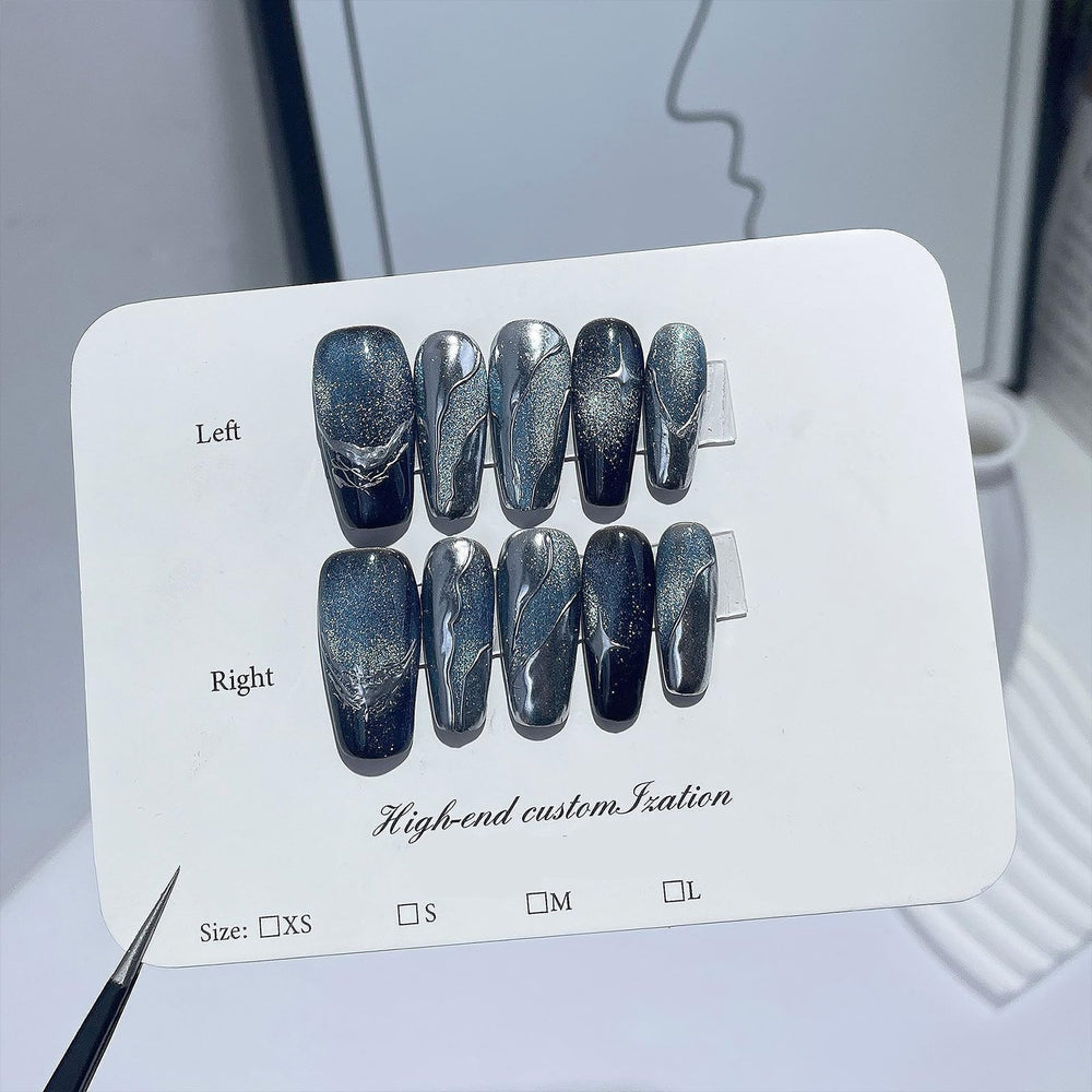 Handmade black French-tip full-cover nails create chic contrast and durability.