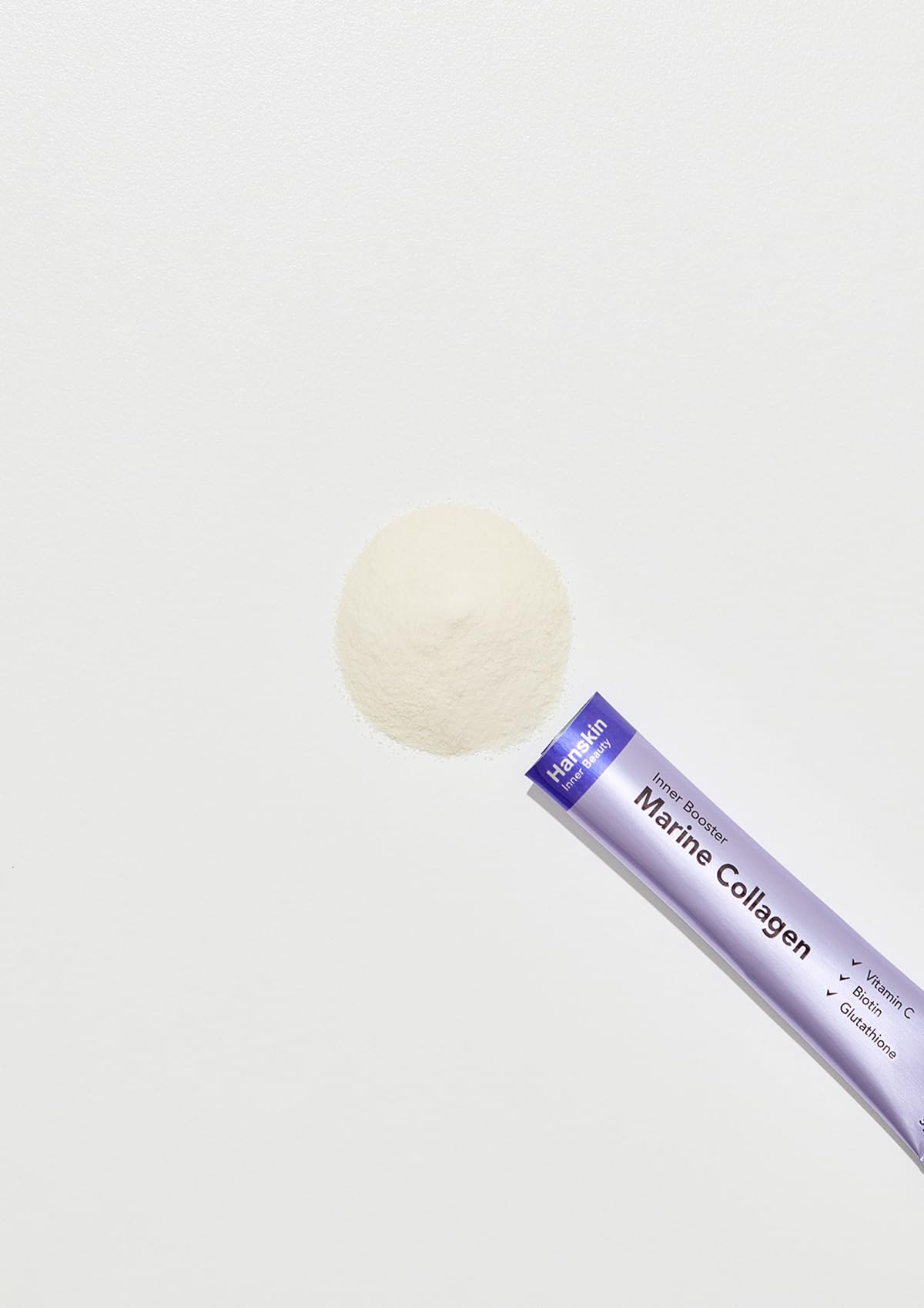 Close-up of collagen powder packet ingredients showing Biotin, Vitamin C, and Glutathione