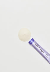 Close-up of collagen powder packet ingredients showing Biotin, Vitamin C, and Glutathione