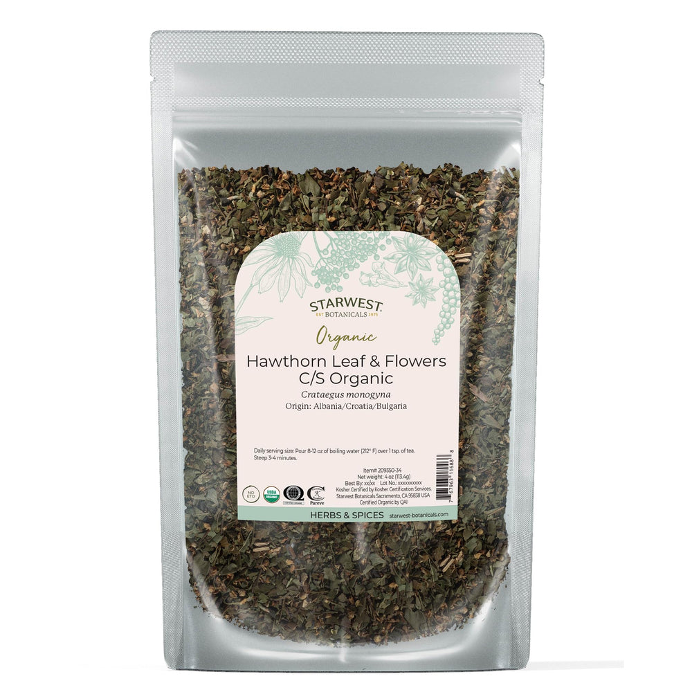 Dried hawthorn leaves and small white flowers in a loose leaf blend