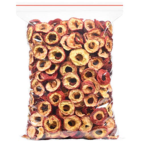 Seedless hawthorn slices close-up with red peel