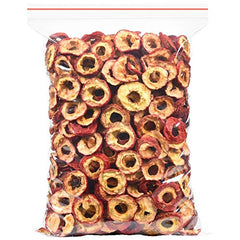 Seedless hawthorn slices close-up with red peel