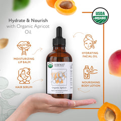 Close-up of HBNO Organic Virgin Apricot Oil bottle with label