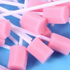 Single pink oral swab close-up