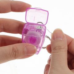Pocket-sized dental floss in a keychain case