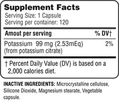 Glass of water beside Health Potassium Citrate bottle