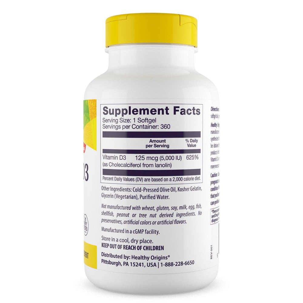 Softgel capsules spilling from bottle onto white background