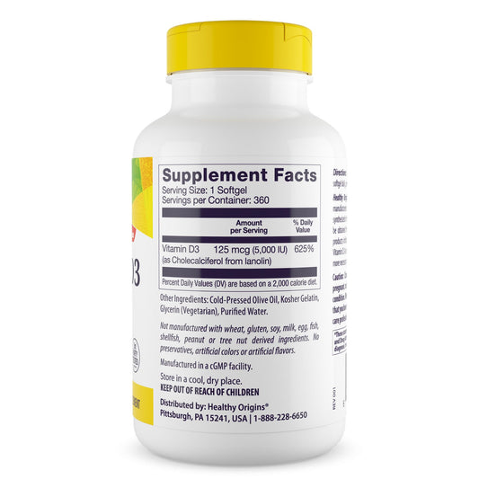 Softgel capsules spilling from bottle onto white background