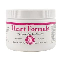 HeartCare Blend bottle surrounded by plant-based ingredients