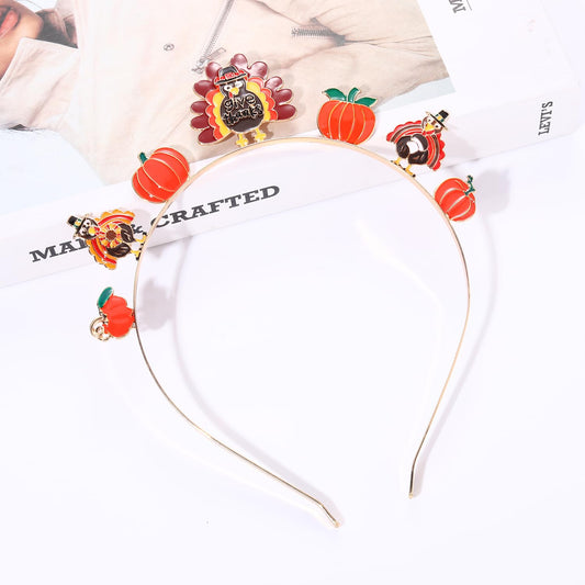 HEIDKRUEGER fall headband with pom poms and enamel charms