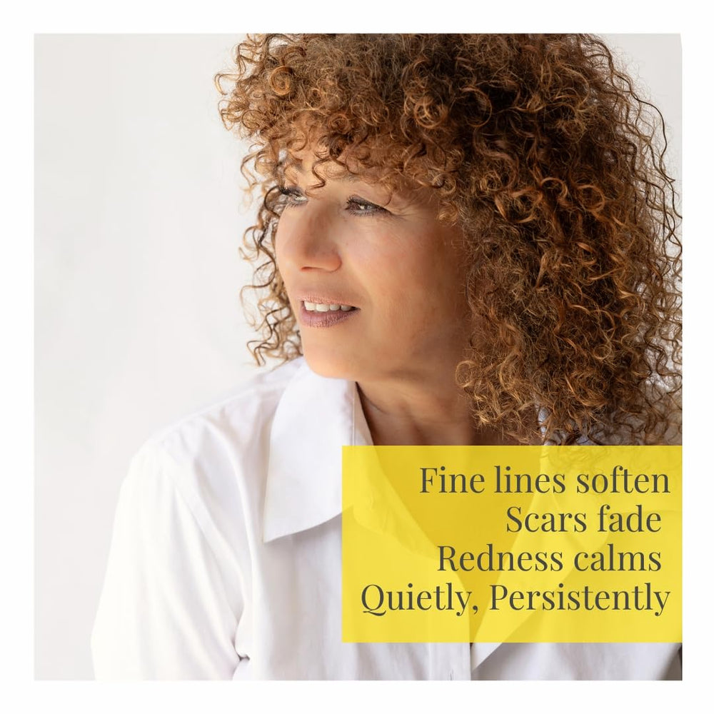 Helichrysum Italicum essential oil bottle with golden jojoba oil.