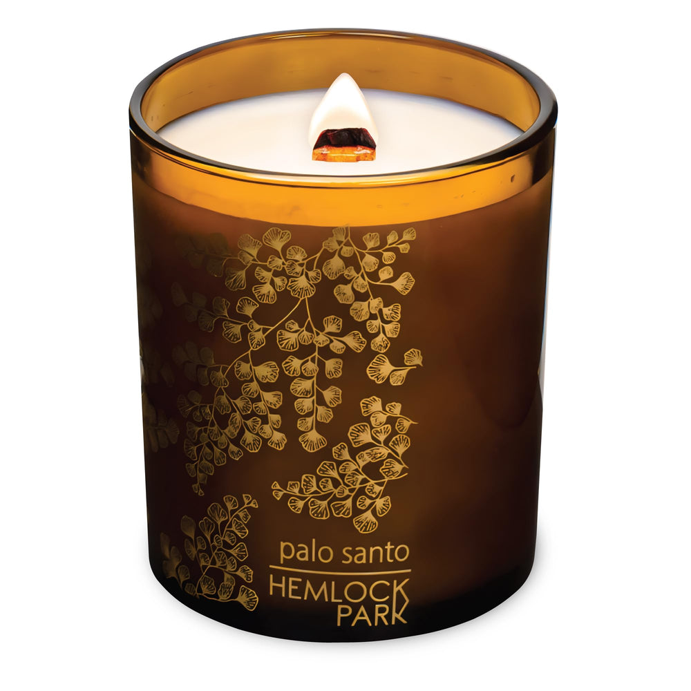 Close-up of wood wick in Hemlock Park Amber Gold Leaf Glass Candle