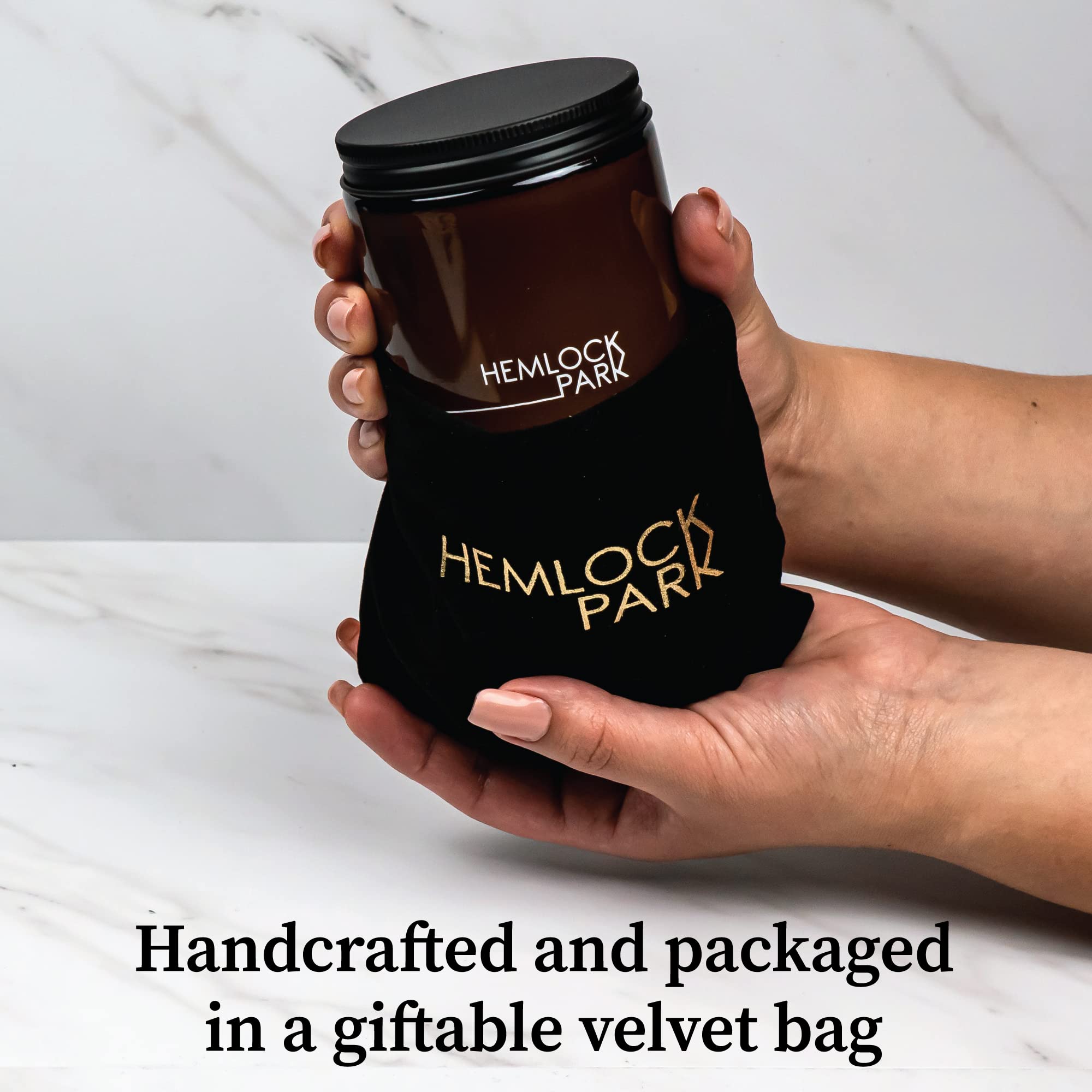 Giftable packaging for Hemlock Park candle: velvet pouch and box