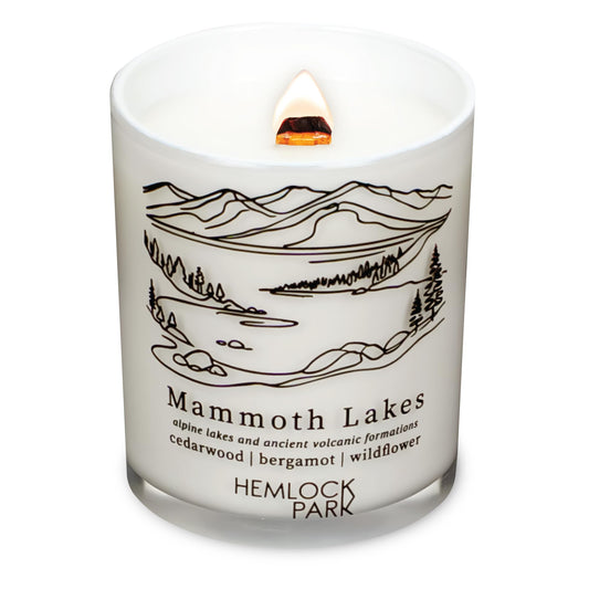 Hemlock Park travel inspired candle with crackling wood wick in a white glass jar (7.2 oz) from Mammoth Lakes