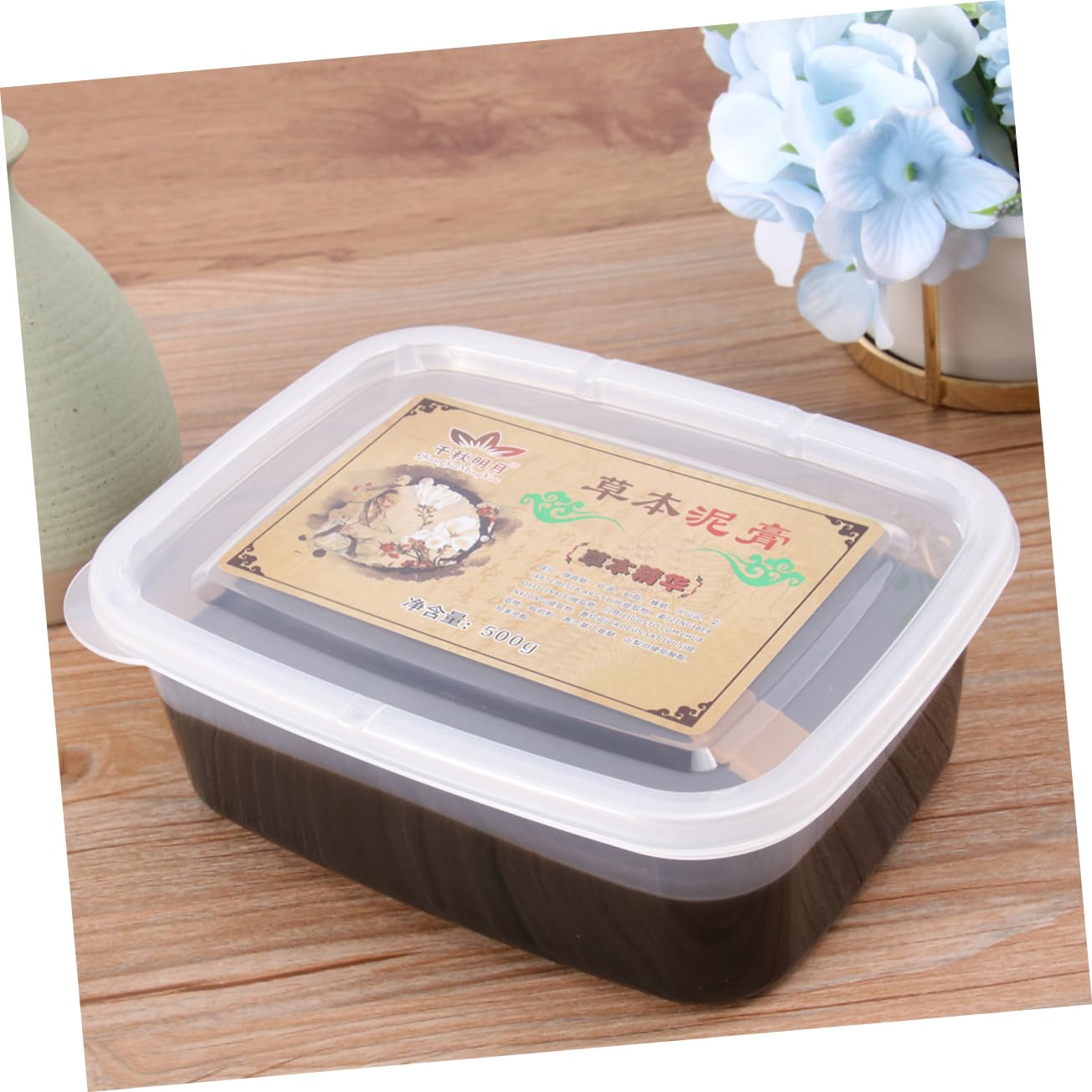 Opened Hemoton moxibustion mud container showing compact size