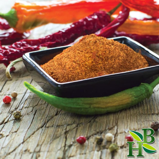 Close-up of African Bird Pepper Powder in a 4oz pouch showing vibrant red color