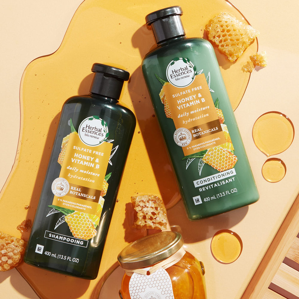 Pouring conditioner to show creamy texture and detangling-friendly formula.